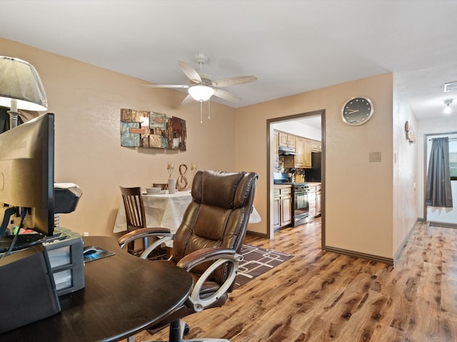 office area featuring ceiling fan and light wood-type flooring