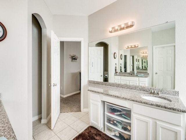 bathroom featuring tile patterned flooring and vanity