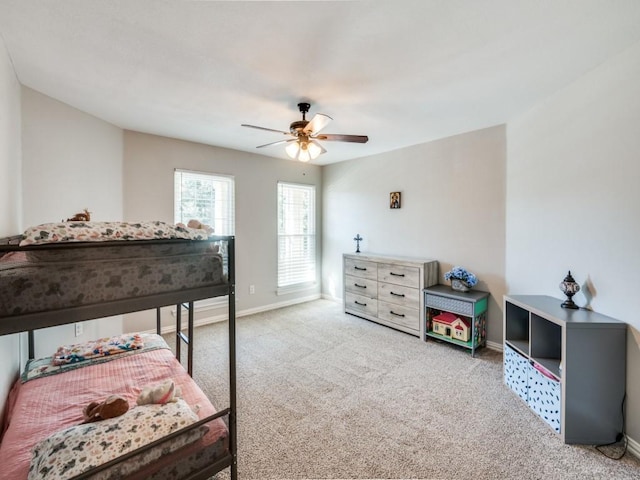 bedroom featuring ceiling fan and light carpet