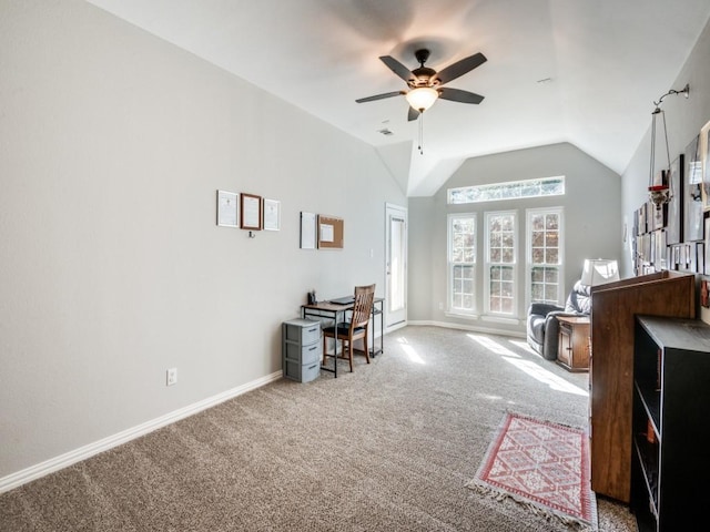 carpeted office space featuring ceiling fan and lofted ceiling