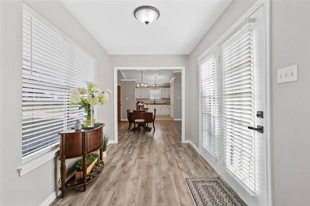 corridor featuring light hardwood / wood-style flooring