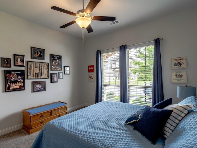 bedroom featuring ceiling fan and carpet