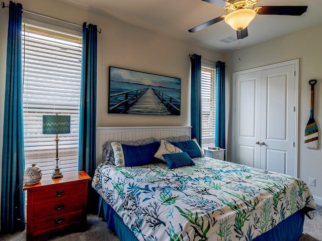 bedroom featuring carpet floors, ceiling fan, and a closet