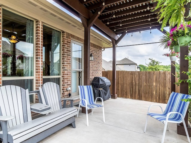 view of patio featuring a grill