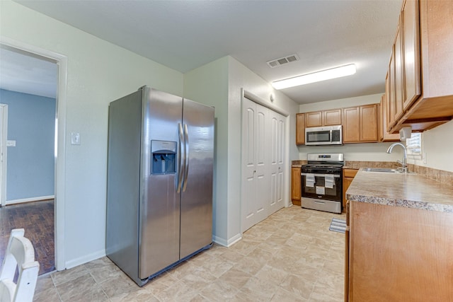 kitchen with sink and stainless steel appliances