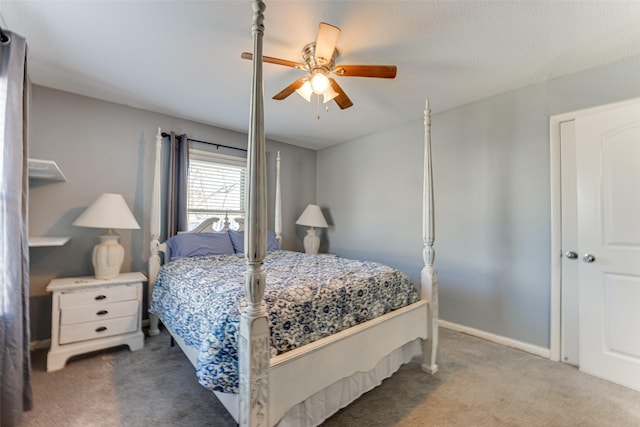 bedroom featuring ceiling fan and carpet