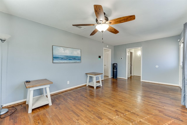 misc room featuring hardwood / wood-style floors and ceiling fan