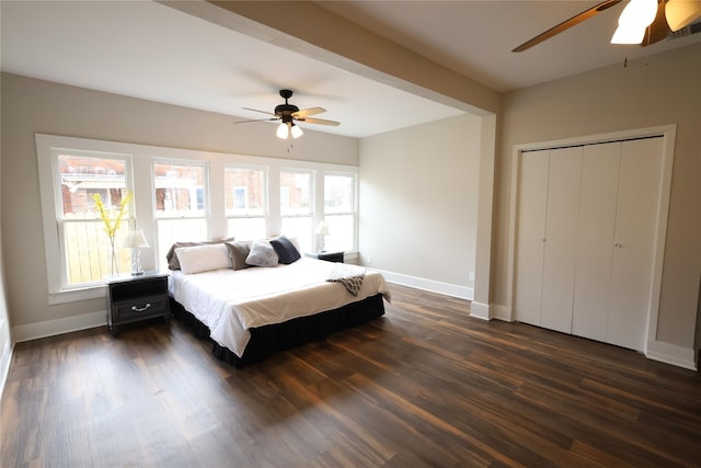 bedroom featuring a closet, ceiling fan, and dark hardwood / wood-style flooring