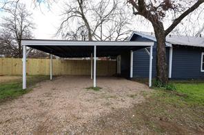 exterior space featuring a carport