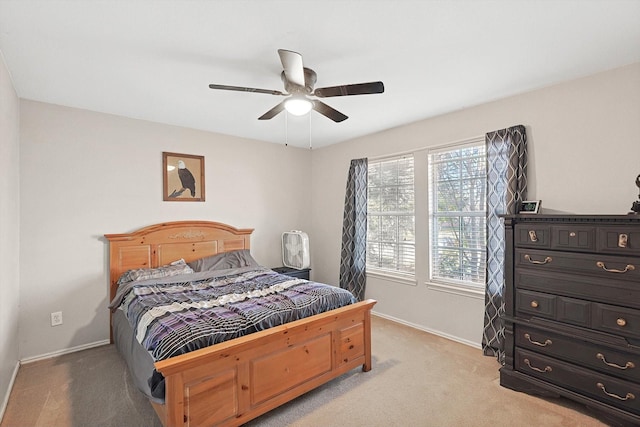 bedroom featuring ceiling fan and light colored carpet