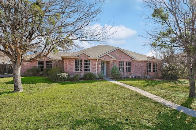 ranch-style house featuring a front lawn