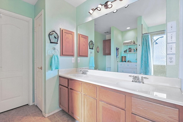 bathroom with tile patterned flooring, vanity, and curtained shower