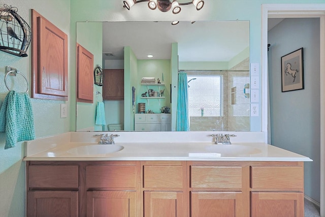 bathroom featuring a shower with curtain and vanity