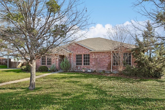 ranch-style house with a front yard