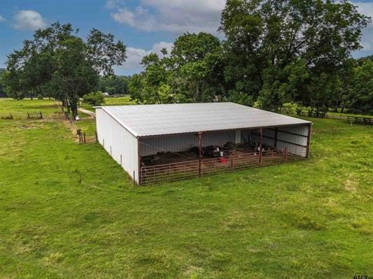 view of outbuilding featuring a rural view