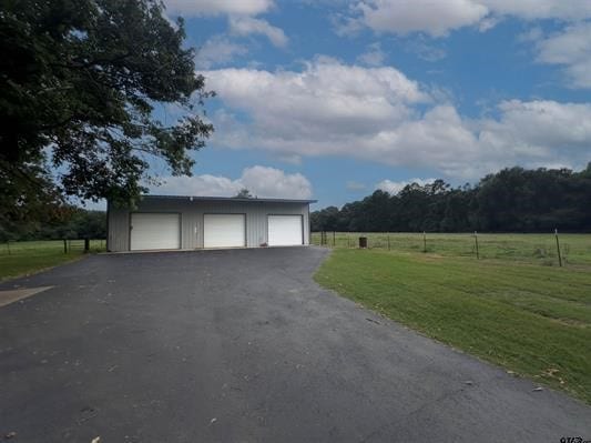 garage featuring a lawn