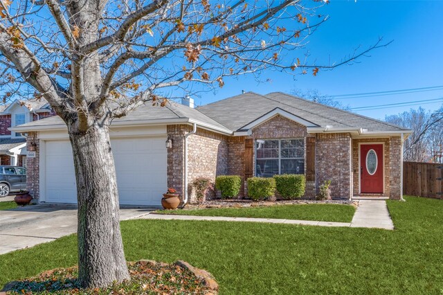 single story home with a front yard and a garage