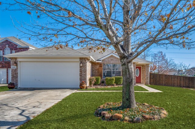 single story home with a garage and a front lawn