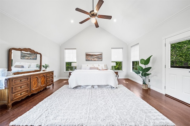 bedroom featuring ceiling fan, dark hardwood / wood-style floors, crown molding, and vaulted ceiling