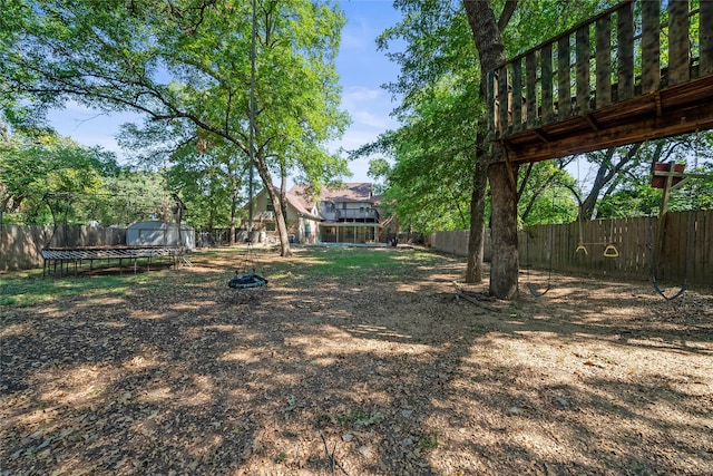 view of yard with a trampoline