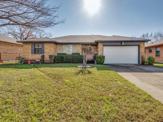 view of front of property with a front lawn and a garage