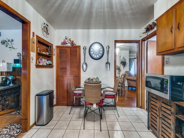 dining space with light tile patterned flooring