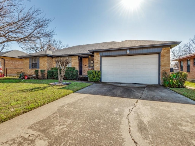 single story home with a front yard and a garage