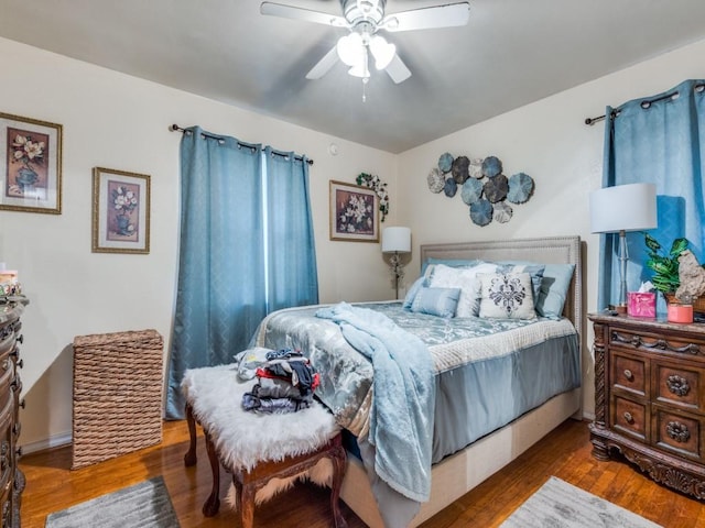 bedroom featuring hardwood / wood-style floors and ceiling fan