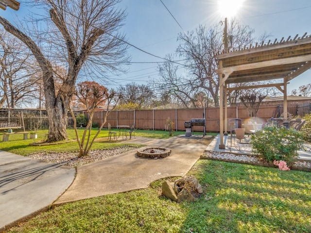 view of yard with a patio and an outdoor fire pit