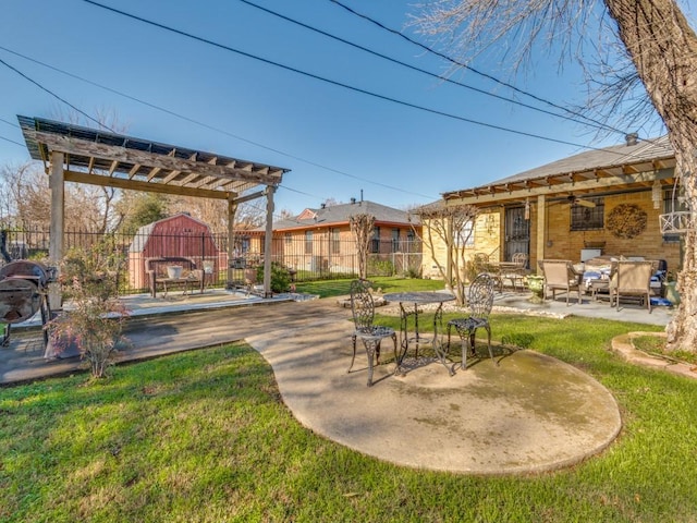 view of patio / terrace with ceiling fan and a pergola