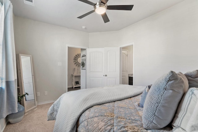 carpeted bedroom with ceiling fan