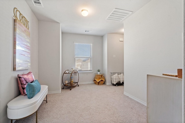 sitting room with light colored carpet