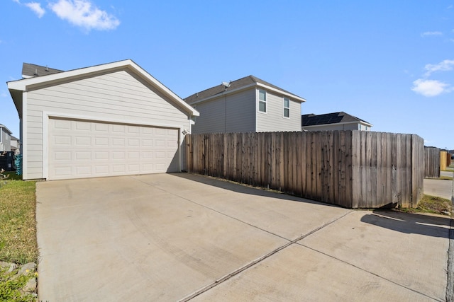 view of home's exterior featuring a garage and central air condition unit