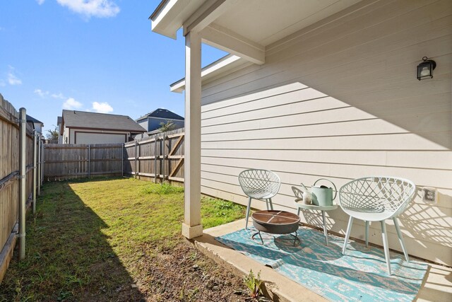 view of patio featuring a fire pit