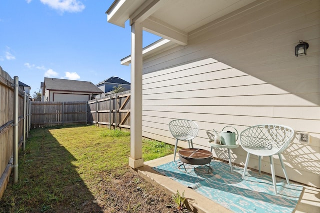 view of patio with a fire pit