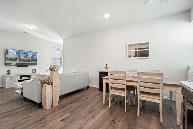 dining space with dark wood-type flooring