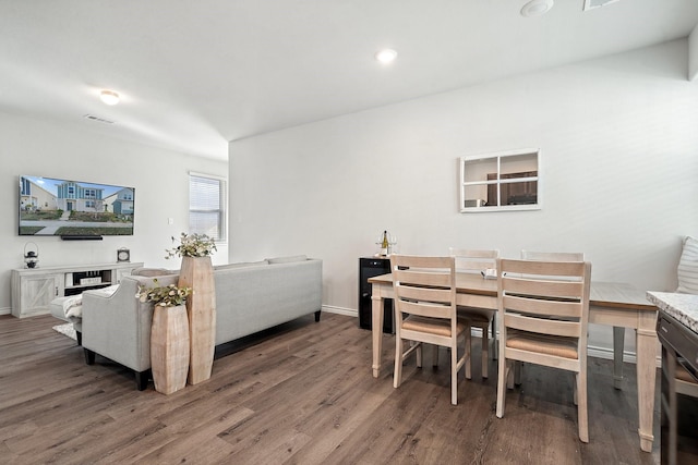 dining room with dark hardwood / wood-style flooring