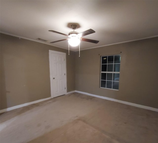 carpeted empty room with ceiling fan and ornamental molding