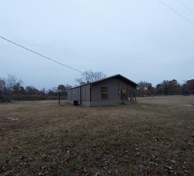 view of home's exterior with a yard