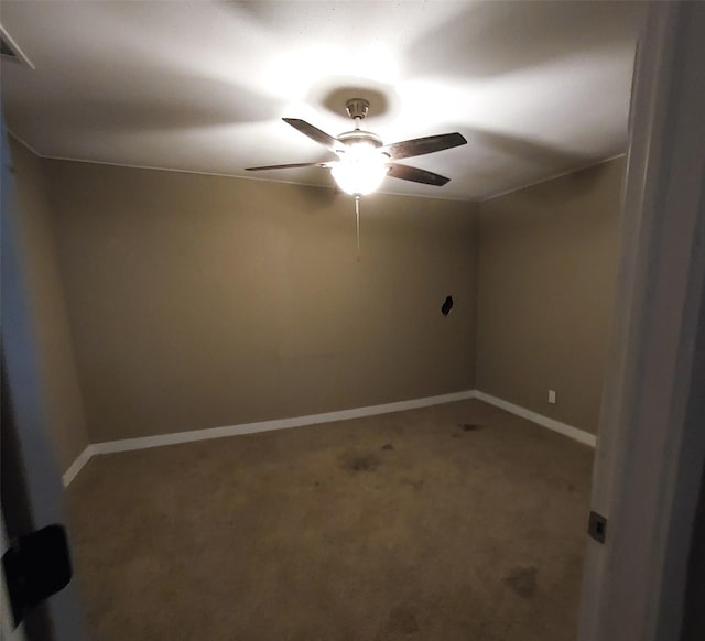 empty room with carpet flooring and ceiling fan