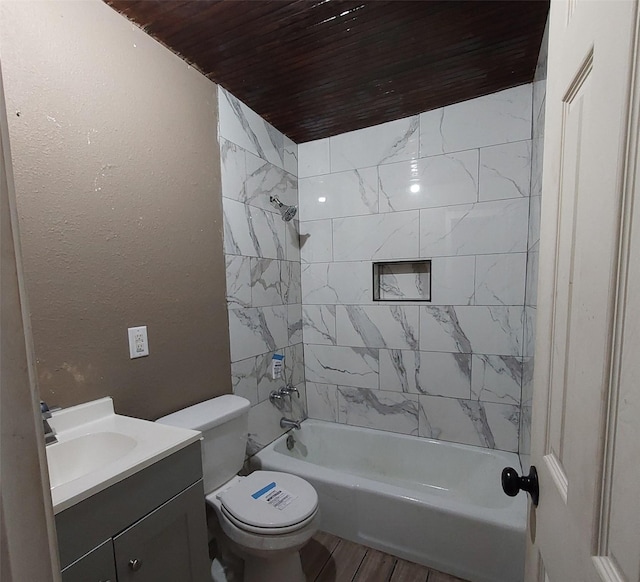 full bathroom with tiled shower / bath, wood-type flooring, vanity, wood ceiling, and toilet