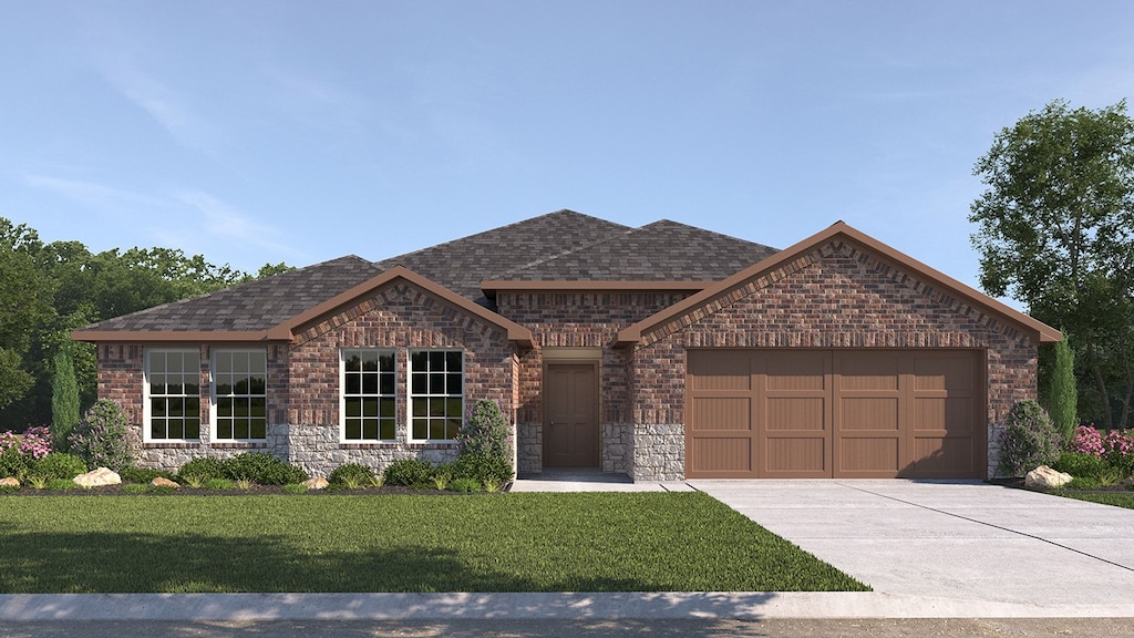 view of front of house with a garage and a front lawn