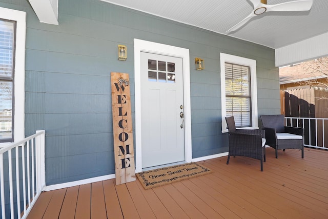 doorway to property with ceiling fan and covered porch