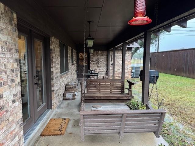 view of patio with a porch and cooling unit