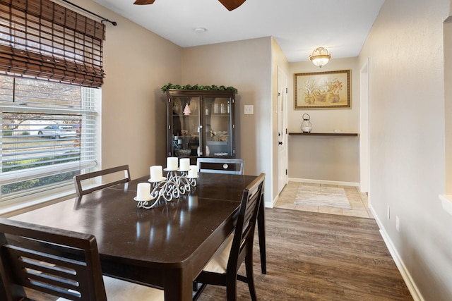 dining space featuring hardwood / wood-style flooring and ceiling fan