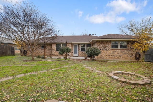 ranch-style house featuring a patio area and a front lawn