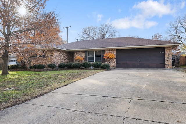 single story home with a front lawn and a garage