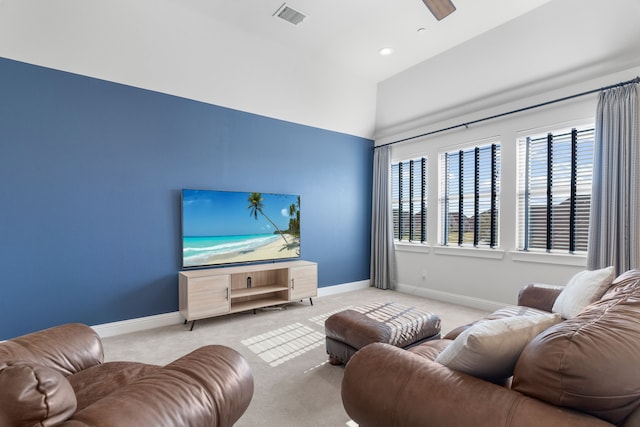 living room featuring light colored carpet and ceiling fan