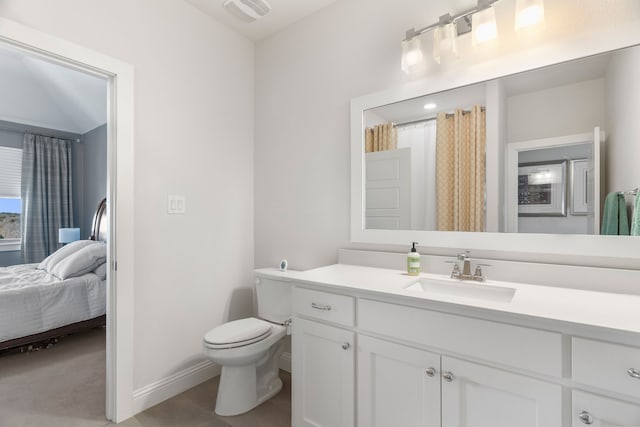 bathroom with vanity and toilet