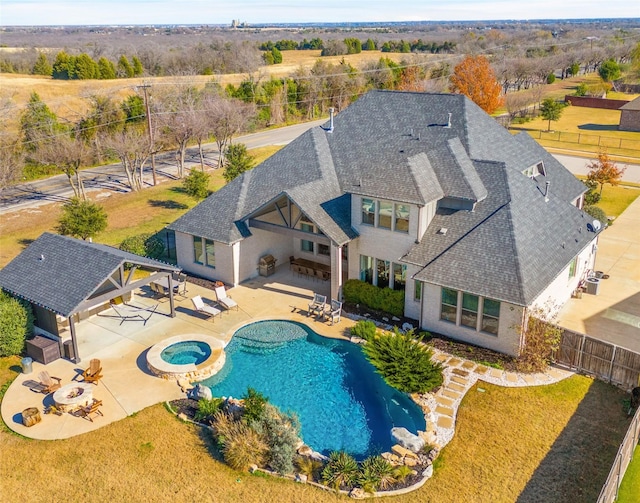 view of swimming pool with a lawn, a patio area, an in ground hot tub, and an outdoor living space